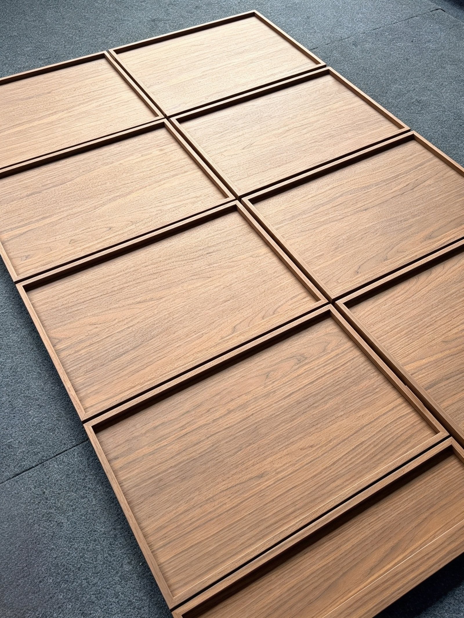 Detailed view of the frame and panel profile on a walnut veneer cabinet door
